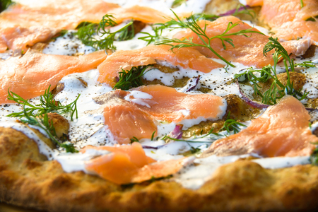 Pizza with salmon slices in detailの写真素材