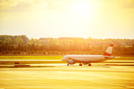 Heat waves distort jet airplane that is on the runway prior departureのeditorial素材