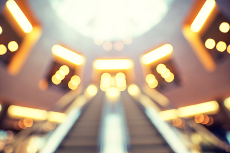 Blurred inside shopping center building with bokeh light background interior and mall backgroundの写真素材