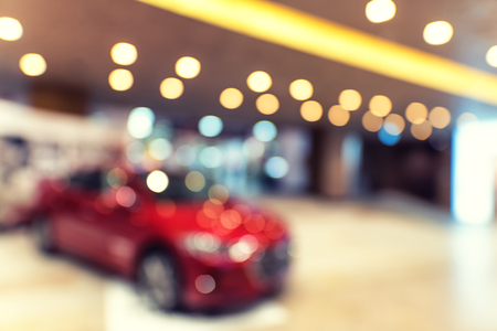 Blurry car inside shopping center building with bokeh light background interior and mall backgroundの写真素材