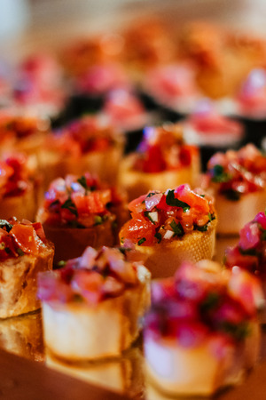 Italian Bruschetta or Crostini With Tomato Basil on displayの写真素材