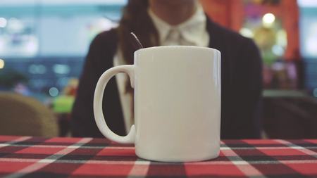 girl stirs hot drinkの写真素材