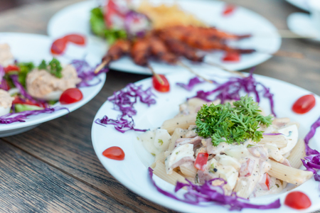 Macaroni cheese and ham on wooden backgroundの写真素材