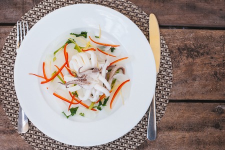 Delicious steamed squid with vegetables for healthy seafood menuの写真素材
