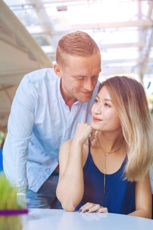 Happy multicultural couple smilingの写真素材