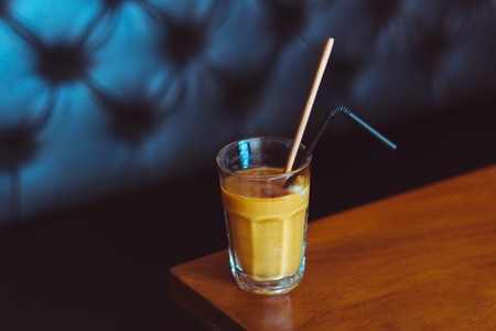 Ice coffee on a wooden tableの写真素材