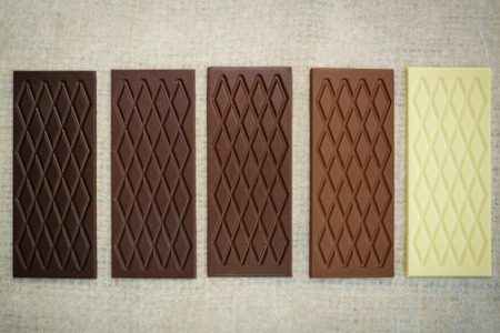 Bars of white, dark, bitter an milk chocolate
