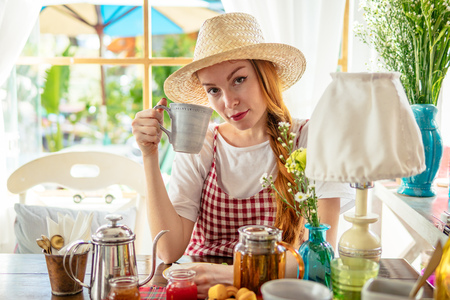 Village girl drinking tea.の写真素材
