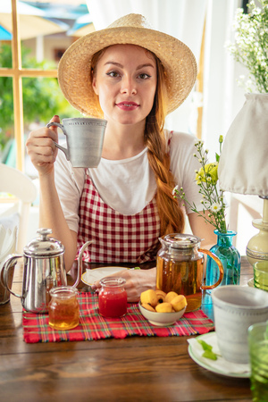 Village girl drinking tea.の写真素材