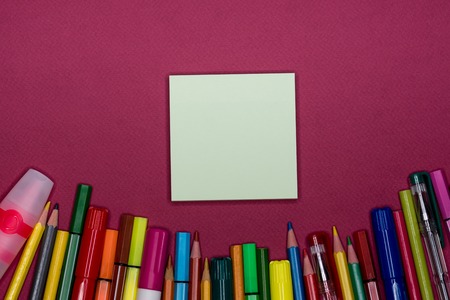 Sticky note, pencils on colorful background, blank copy spaceの写真素材