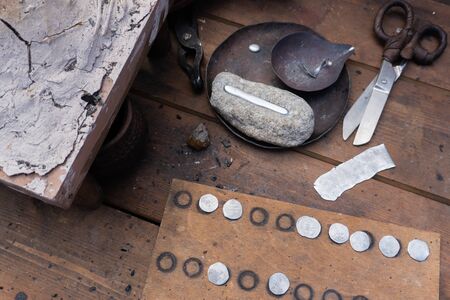 Manual coinage. coinage in the anvil. Work place. Ancient Russia art.の写真素材