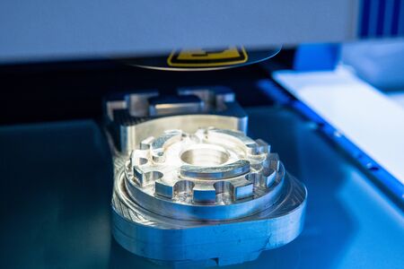 Custom metal part manufactured in CNC milling machine. Close upの写真素材