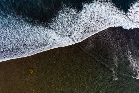 Aerial view to ocean waves. Blue water backgroundの写真素材