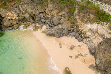 Aerial view of sandy beach and ocean with wavesの写真素材