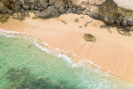 Aerial view of sandy beach and ocean with wavesの写真素材