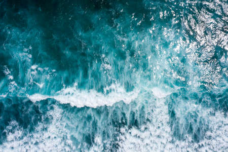 Aerial view to ocean waves. Blue water backgroundの写真素材