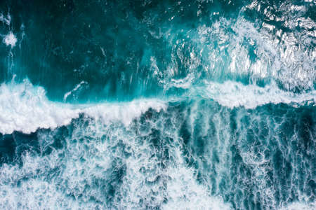 Aerial view to ocean waves. Blue water backgroundの写真素材