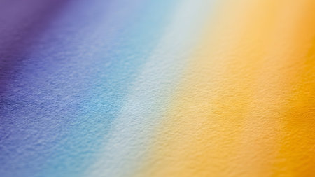 Gentle gradient of watercolor texture, blending blue, yellow, and purple. Soft, calming, and abstract, creating a serene and visually appealing background.の素材