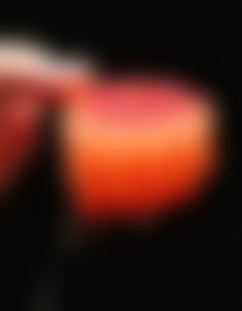 Abstract background with bokeh defocused lights on black background.の写真素材