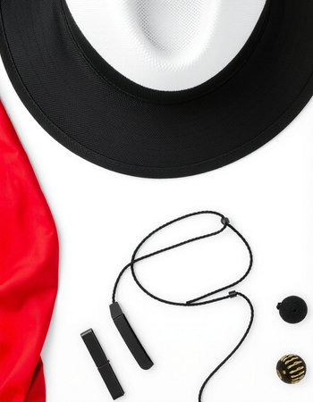 Black hat, earrings and cosmetics on white background. Top view.の写真素材