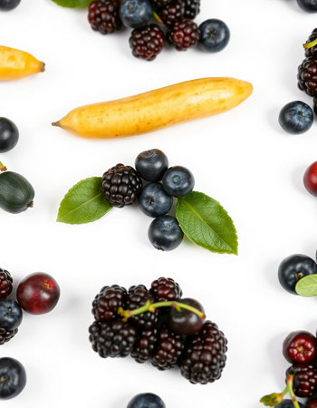 Blackberries, blueberries, cherries and bananas on white background