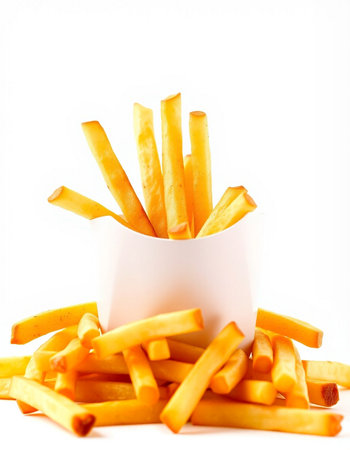 French fries in a white bowl on a white background. Isolated