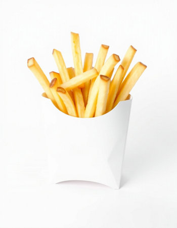French fries in a white paper box on a white background with copy space