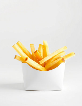 French fries in a white box on a white background, close-up