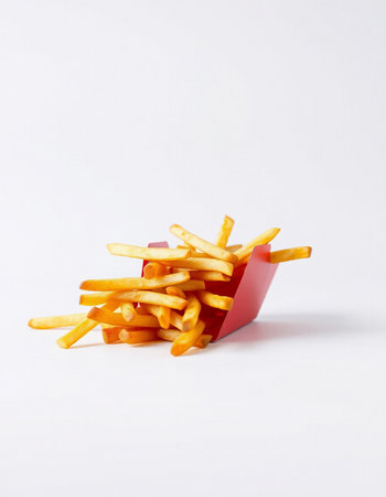 French fries in a red box on a white background, fast food