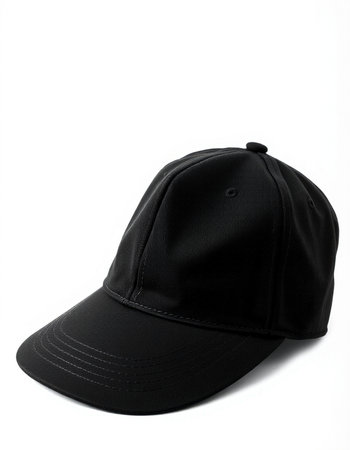Black baseball cap isolated on white background. Side view. Close-up.