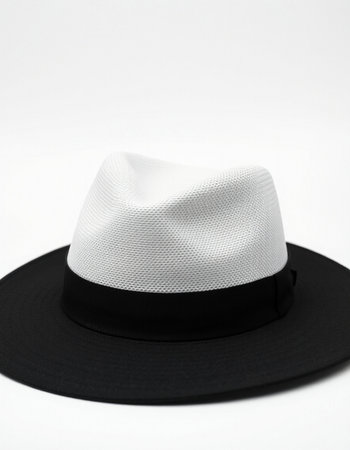 White hat on a white background. White hat with black hat.の写真素材