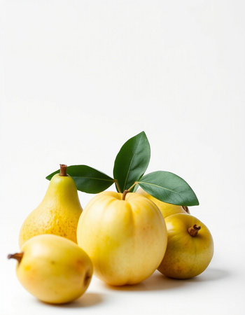 Yellow pears with leaves on a white background. Studio photography.