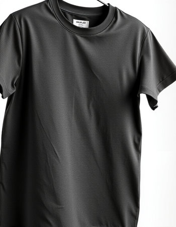Black t-shirt mockup on a white background, front viewの写真素材
