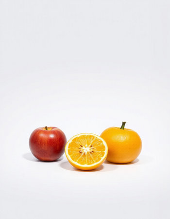 Orange and apple on a white background. Healthy food concept. Isolated.の写真素材