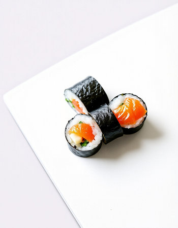 Sushi rolls on a white plate. Shallow dof.