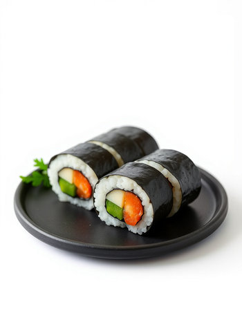 Sushi rolls on a black plate isolated on a white background.の写真素材