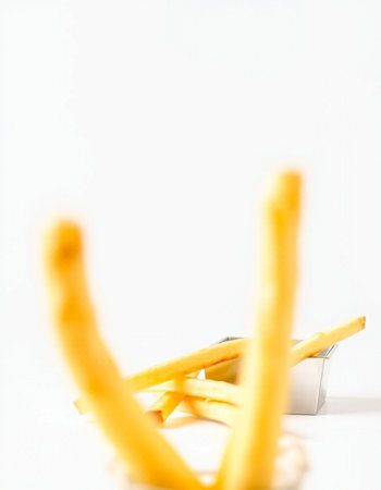 French fries on a white background. Shallow depth of field.の写真素材