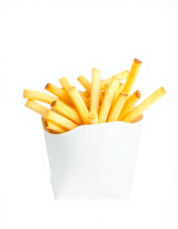 French fries in a white paper box isolated on a white background.