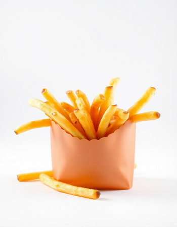 French fries in a paper box on a white background. Selective focus.の写真素材