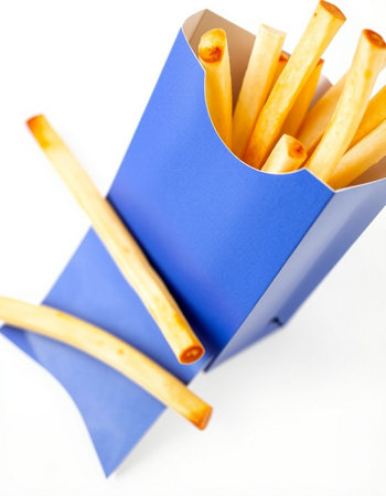 French fries in a blue box on a white background. Close up.の写真素材