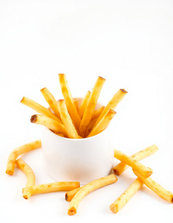 French fries in a bowl on a white background. Selective focus.
