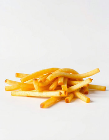Pile of french fries isolated on white background. Selective focus.の写真素材
