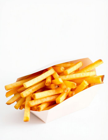 French fries in paper box on white background. Selective focus.