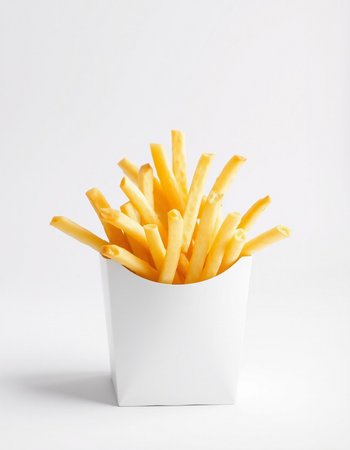 French fries in a white box on a white background, close-upの写真素材