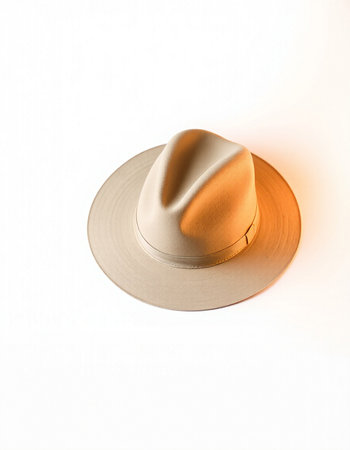Beige hat isolated on a white background. Minimal style.の写真素材