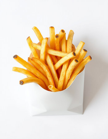 French fries in a paper box on a white background, top viewの写真素材
