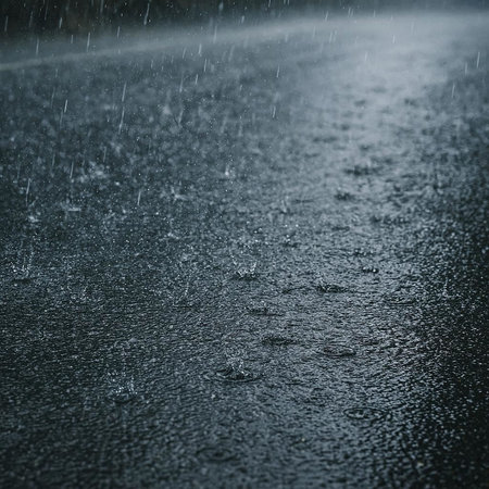 Raindrops on the road. Raindrops on asphalt. Rainy weather.の写真素材