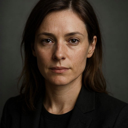 Portrait of a woman in a black jacket on a dark background