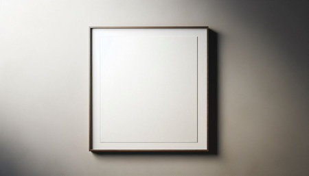Empty picture frame hanging on a white wall. Mockup for design