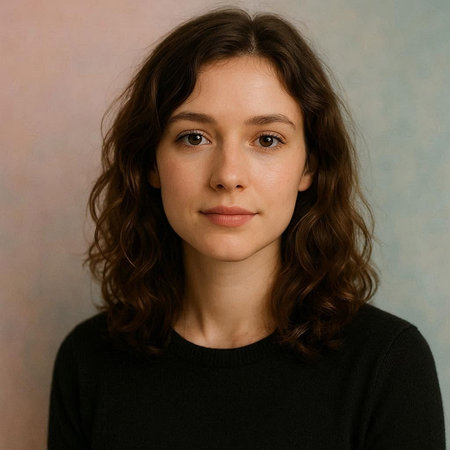Portrait of a beautiful young woman with long brown curly hair.